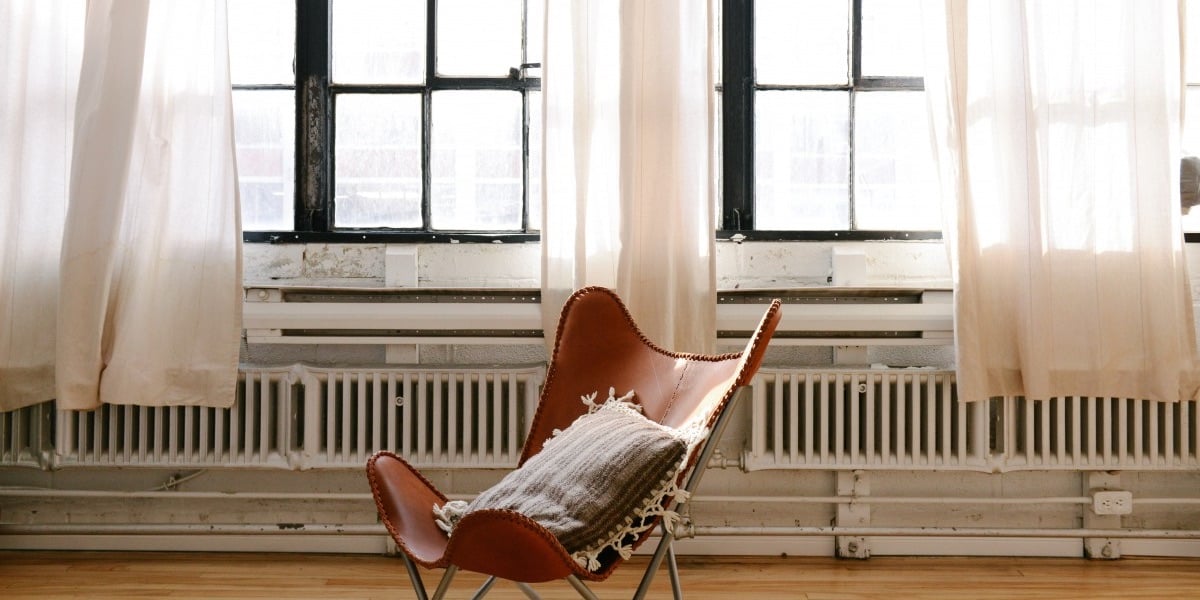 Modern Wooden Chair in Apartment in Font on Large Picture Windows